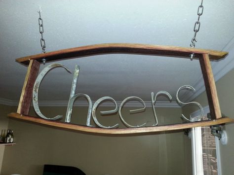 Cheers! This handmade sign is crafted from retired oak wine barrels. The letters are made using the bands of the wine barrel. Can be hung from ceiling Bourbon Barrel Decor, Wine Barrel Lighting, Wine Barrel Signs, Wine Barrel Art, Wine Barrel Decor, Wine Barrel Rings, Lumber Rack, Barrel Projects, Wine Barrel Furniture