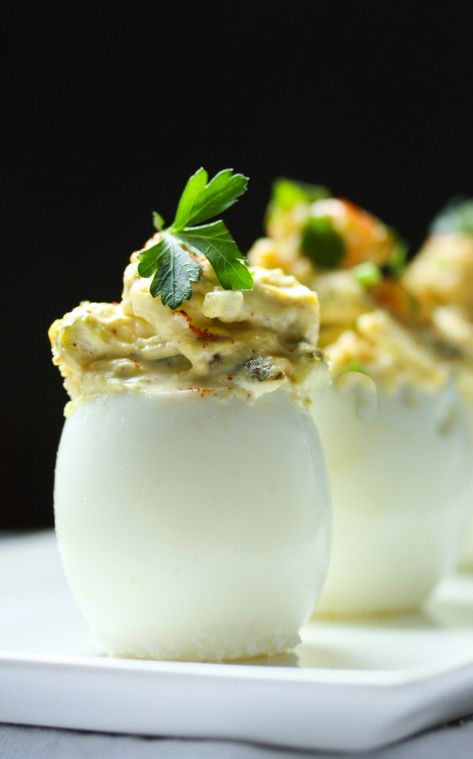 The Best EVER Deviled Eggs- Made with crumbled bacon, cheddar and onion, simple and soooooo delicious! | www.feastingathome.com Elegant Deviled Eggs, Best Ever Deviled Eggs, Vegan Bacon Bits, Feasting At Home, Best Deviled Eggs, Bacon Deviled Eggs, Deviled Egg, Summer Eating, Crumbled Bacon