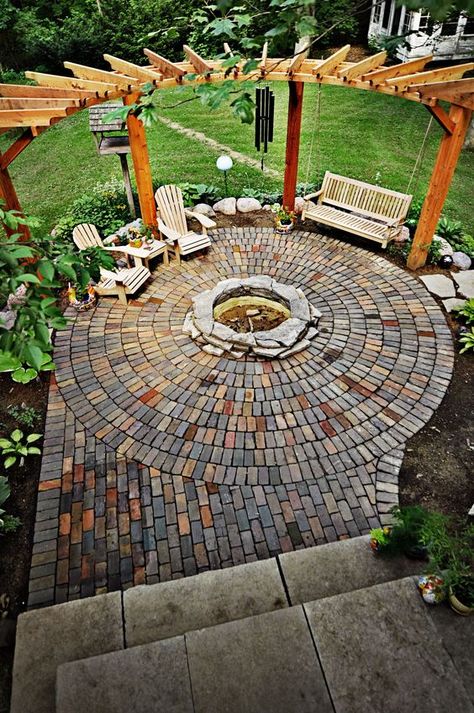 circle clad brick patio with a fire pit and a swinging day bed Cottage Backyard, Backyard Getaway, Fire Pit Landscaping, Pergola Ideas, Backyard Fireplace, Fire Pit Area, Backyard Pergola, Brick Patios, Backyard Fire