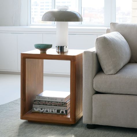 Elevate your space with the sophistication of our CALI END TABLE. Crafted from durable acacia wood in a chic walnut finish, this end table offers open and closed storage options. Its airy, slim design creates a sense of spaciousness, making it the perfect addition to any room. Size Overall: 18"sq. x 22"h Clearance Underneath: 2.2" Product Weight: 43.5 lbs.CareWipe clean with a soft, dry cloth. To protect the finish, avoid use of chemicals and household cleaners. Hardware may loosen over time; periodically check that all connections are tight. Side Table Design, Marble Side Tables, Sofa Side Table, Side And End Tables, Modern Side Table, Round Side Table, Shop Chair, Table Style, West Elm