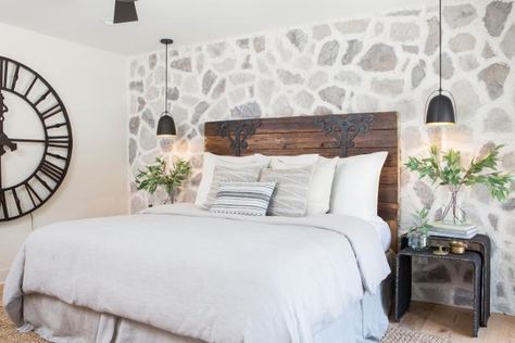 As seen on HGTV's Fixer Upper, this remodeled master bedroom features a stone accent wall. Tuscan Homes Interior, Mediterranean House Interior, Luxury Mediterranean Homes, Mediterranean Home Interior, Mediterranean Interior Design, Bedroom Gray, Rustic Bedroom Design, Mediterranean Interior, Mediterranean House Plans