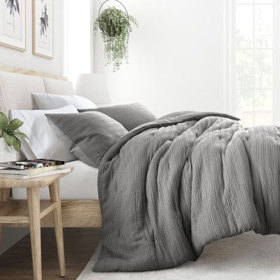 Indulge in the epitome of comfort with our exquisite 3-piece waffle textured comforter set. Its polyester fill ensures a dreamy sleep experience, while the soft pre-wash finish and double-brushed fabric provide a luxurious touch. Plus, its oversized dimensions are perfect for extra deep mattresses. Elevate your sleep sanctuary today and embrace the ultimate in cozy sophistication. This bedding set is great for any master bedroom, guest room, kids or dorm room. Ebern Designs Color: Gray, Size: Ki Grey Comforter Bedroom, Light Blue Comforter, Textured Comforter, Costal Bedroom, Bedding Blue, Bedroom Comforter Sets, Grey Comforter, Blue Comforter Sets, Grey Duvet