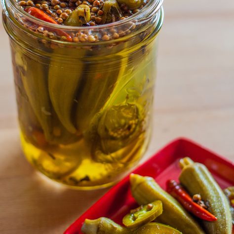 Super-simple spicy okra pickles are canned with fresh jalapeños and dried chile peppers can be made even spicier with red chili flakes. Pickled Okra Recipe, Pickled Okra Recipes, Spicy Okra, Hot Pickles, Pickle Vodka, Okra Recipe, Pickled Okra, Okra Recipes, Pickled Veggies