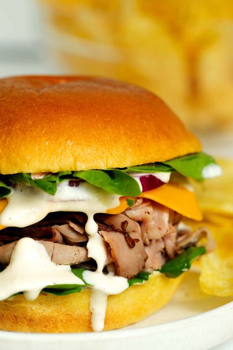 Close up of creamy horseradish sauce on a cold roast beef sandwich Roast Beef Panini Sandwiches, Roast Beef Panini, Hot Roast Beef Sandwiches, Roast Beef Sandwich Recipes, Creamy Horseradish, Beef Sandwich Recipes, Creamy Horseradish Sauce, Roast Beef Sandwich, Sliced Roast Beef