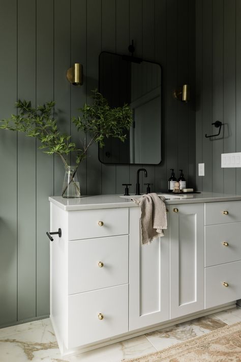 Green Guest Bathroom, Unique Laundry Room, Green Bathroom Paint, Oakstone Homes, Earthy Bathroom, Laundry Room Cabinet, Laundry Room Countertop, Black Cabinet Hardware, Benjamin Moore White