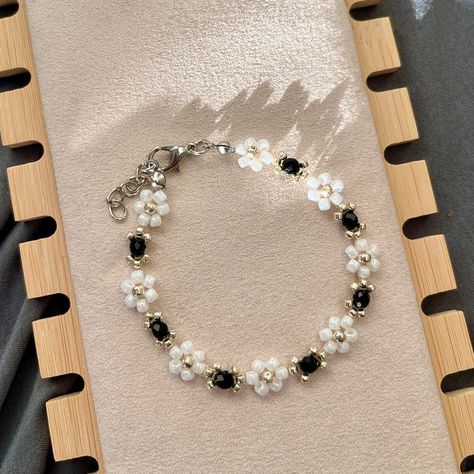 White Daisy with Black Gemstone in silver bead🦨🩶 This set is also available in gold bead. Customise the colour and size in Etsy. Link in bio! 🤍 All products are made with Japanese TOHO beads to prevent colour fading and ensure a uniform pattern. #handmade #jewellery #jewelry #aus #smallbusiness #smallbusinessaustralia #bracelets #handmadejewelry #handmadebracelet #handmadebracelets #smallbusinesssupport #bracelet #handmade #handmadecrafts #handmadejewellery #cutebracelets #cutebracelet #b... Dark Bracelet Ideas, Black Beads Bracelet Gold, Beaded Patterns, Black Beaded Bracelets, Toho Beads, White Daisy, Gemstone Beaded Bracelets, Cute Bracelets, Silver Bead