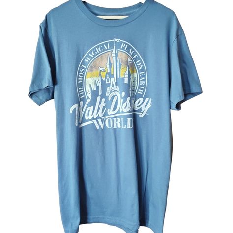 Experience The Enchantment Of Disney With This Walt Disney World (Wdw) Dusty Blue Tee! This Short Sleeve Shirt, Featuring The Phrase "The Most Magical Place On Earth," Showcases A Vintage-Style Design With The Iconic Castle And A Beautiful Sunset In The Background. Perfect For Disney Fans, This Tee Captures The Nostalgic Charm Of Walt Disney World And Is Ideal For Casual Wear Or A Trip To The Parks. Celebrate The Magic Of Disney With This Stylish And Comfortable Piece! Size: Measurements Are App 50th Anniversary Tshirt, Lion King Shirt, Disney Shorts, Mickey Mouse T Shirt, Recycled T Shirts, Stitch Shirt, Back Pictures, Disney Tees, Black Graphic Tees