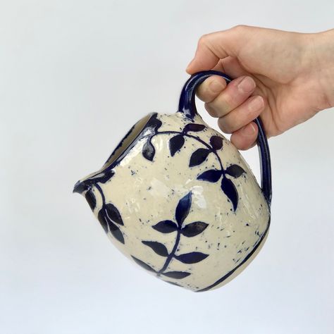 blue and white handmDe leaf design jug by HabulousCeramics on Etsy https://www.etsy.com/uk/listing/621014613/blue-and-white-handmde-leaf-design-jug Ceramic Crafts, Face Planters, Jug Vase, Sgraffito, Stoneware Mugs, Hand Thrown, Leaf Design, Flower Arrangements, Stoneware