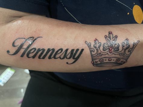 Hennessy Tattoo Designs, Hennessy Tattoo, Crown Tattoo On Hand, Name With Crown Tattoo For Men, Tattoo Names With Crowns, Princess Crown Tattoo With Name, Name Tattoo, Arm Tattoo, I Tattoo