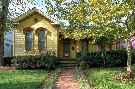 C 1910 Victorian Cottage House.  Enchanting Chartreuse Yellow Green, with Pumpkin Orange colored Trim create the perfect Fall Season home.  Exterior View Daytime Fall Halloween Victorian Cottage House, 1910 House, Colored Trim, Victorian Cottage, Modern Victorian, Home Exterior, Cottage House, Victorian House, Exterior Paint Colors