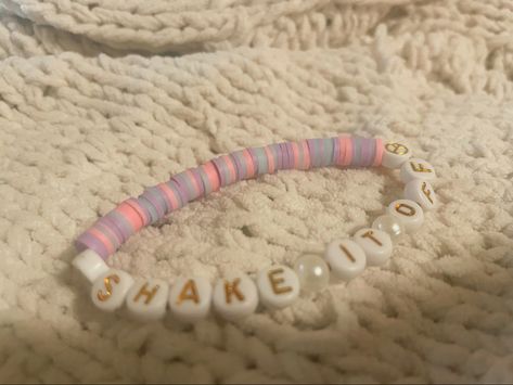 clay bead bracelet that says shake it off which is a song by taylor swift Shake It Off Taylor Swift Bracelet, Clay Beads Taylor Swift, Taylor Swift Clay Bead Bracelet Ideas, Shake It Off Bracelet, Taylor Swift Bracelet Ideas Clay Beads, Taylor Swift Clay Bead Bracelet, Taylor Bracelets, Taylor Bracelet, Swift Bracelet