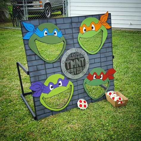 Ninja Turtles Birthday Party  I made this game, "Feed the Turtles" for my nephew's birthday party  :) Ninja Turtle Cornhole, Ninja Turtles 1st Birthday Party Ideas, Pin The Mask On The Ninja Turtle, Ninja Turtles Birthday Party Activities, Ninja Turtles Party Games, Ninja Turtle Birthday Party Games, Ninja Turtle Games For Party For Kids, Ninja Turtle 2nd Birthday, Ninja Turtles Birthday Party Games