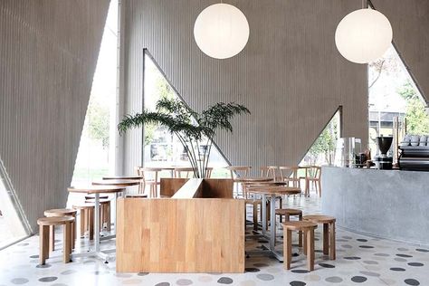 Bogotá artisanal bakery Masa brings the architetural edge with second café Artisanal Bakery, Artisan Cafe, Concrete Bar, Tiered Seating, Outdoor Aesthetic, Retail Space, Wooden Tables, Outdoor Patio, Dining Area