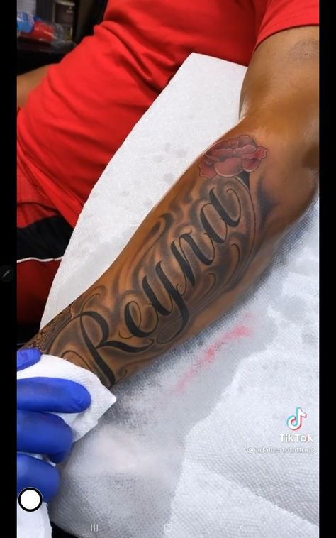 Name Tattoo Shaded, Parent Name Tattoos, Mother Name Tattoo Ideas For Men, Mom Dedicated Tattoos, Mom Names Tattoo Ideas, Forearm Tattoo Men Name, Last Name Arm Tattoo, Tattoo With Moms Name, Mom Shoulder Tattoo Ideas