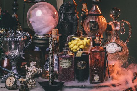 DIY Harry Potter Potion Display for Halloween: Dumbledore's office - Scrapbook.com- Get ready for a spooky Harry Potter Halloween! Grab some old bottles and dress them up with inks, charms, embellishments, paper and glitter! Harry Potter Potions, Festa Harry Potter, Anniversaire Harry Potter, Halloween Potions, Theme Harry Potter, Harry Potter Halloween, Magic Aesthetic, Witch Magic, Harry Potter Diy