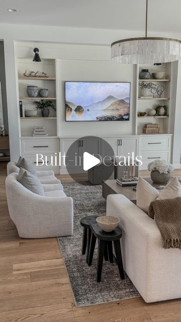 Christine Melin | Design • Home Decor • Lifestyle on Instagram: "Your built-in questions answered! (DETAILS BELOW)

Need a link for decor or hardware? 
✨Comment SHOP & I’ll send them to you.
(in order to receive links from me, you need to be following my account, or IG blocks them) 

(Our entire built-in was custom, nothing was prefabricated) 
•Overall height 10’
•Overall width 11’
•For reference, our TV is 75”

•Shelves are white oak with a custom stain
•Shelves measure 1.5” x 34” x 13” 
•Vertical distance between shelves 17”

•Shaker style drawers/cabs 
•Paint: color matched with kitchen cabs 
  BJ Tidwell White (BJ Tidwell) 
•Center cabinet doors 30” x 20” 
•Drawers 35” x 15” (soft close) 
•Center cabinets pop out 2” from rest of 
  built-in 

•Hardware 5 1/16” & 12” appliance pulls 

O Stain White Oak, Built In Tv Cabinet, Appliance Pulls, Dining Living Room, Appliance Pull, Pop Out, Shaker Style, Question And Answer, My Account