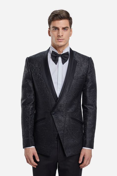 The New Dinner Jackets; a black jacquard tuxedo jacket is punctuated with a double wing pleated lapel and angular cut pocket flaps. The creation is paired with black straight trousers. Think white wing collar shirt,  bowtie and cummerbund. Finish with a pair of leather oxfords and sleek pushed back hair #GauravGupta #GauravGuptaMan #GGMan #Menswear #MensFashion #Cocktail #Reception #Groom #Tuxedo Pushed Back Hair, Menswear Indian, Demi Couture, Wing Collar Shirt, Dinner Jackets, New Dinner, White Wing, Gaurav Gupta, Groom Tuxedo