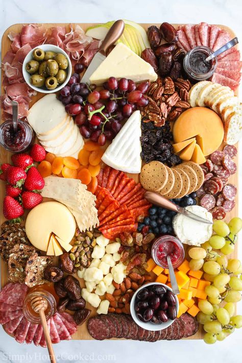 Ultimate Charcuterie Board with an assortment of meats, cheeses, fruit, nuts, bread, crackers, olives, jams, and honey. Bread Crackers, Charcuterie Board Meats, Whole Wheat Crackers, Dessert Inspiration, Picnic Photoshoot, Charcuterie Board Ideas, Charcuterie Inspiration, Charcuterie Cheese, Charcuterie Platter