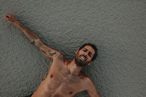 Exhausted man lying on sand after intense workout session. Athlete resting on sand after physical training. Top view. Tired Man, Kettlebell Workouts, Happy Person, Physical Training, Push Up Workout, Men Lie, Getting Divorced, Photoshoot Concept, Kettlebell Workout