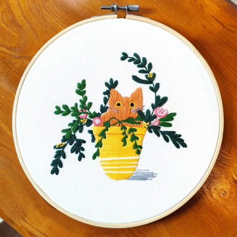 Hand-embroidered ginger cat in a yellow plant pot Ginger Cat Embroidery, Pansy Wreath, Yellow Plants, Cat Embroidery, Ginger Cat, Manchester England, Yellow Cat, Cute Embroidery, Ginger Cats