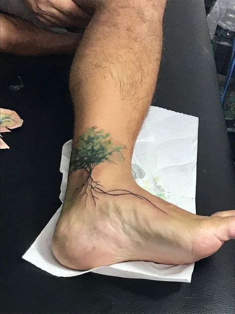 Tree Tattoos With Roots, Ankle Tree Tattoo, Tree Tattoo On Ankle, Root Tattoo, Stomach Tattoo Ideas, Tattoos Tree, Nature Lover Tattoo, Tree Tattoo Ankle, Tattoo Calf