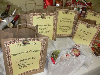 Some of the raffle ticket bags for prizes at the Echo Hose Hook & Ladder Company’s fifth annual Festival of Trees. (Photos by Brad Durrell) Raffle Prize Table Display, Raffle Ticket Box Ideas, Raffle Table Display Ideas, Rose Banquet, Ffa Fundraiser, Foster Closet, Bingo Ideas, Benefit Ideas, Trees Photos