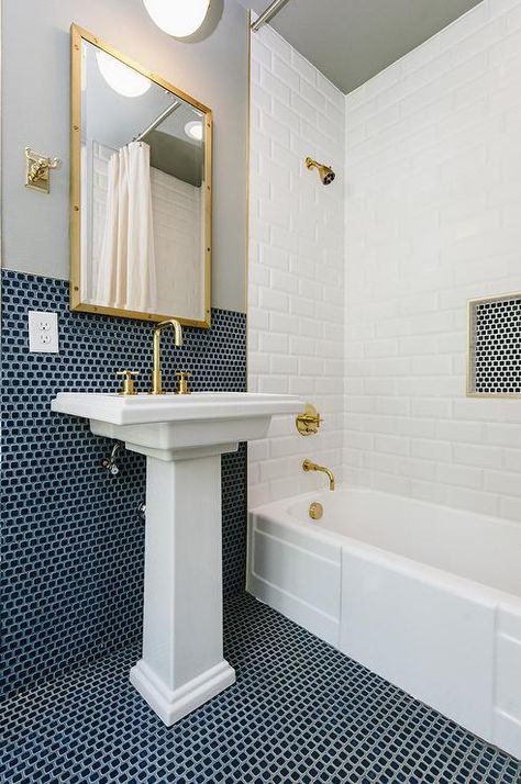 Gold and blue bathroom theme features a Kohler Tresham Pedestal Sink with brass accents. Penny Tile Bathroom, Blue Penny Tile, Penny Tiles Bathroom, Bathroom Tiles Combination, Blue Bathrooms Designs, Navy Bathroom, Ceramic Pedestal, Tiled Bathroom, Trendy Bathroom Tiles