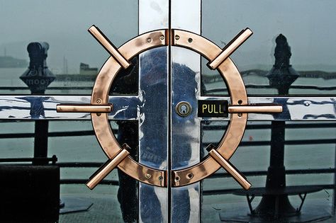 Nautical door handles with ship wheel design. Fisherman's Wharf, San Francisco, CA. #doors #shipwheels Nautical Theme Restaurant, Nautical Restaurant Design, Ship Interior Design, Nautical Restaurant, Ship Restaurant, Seafood Decor, Ship Wheel Decor, Nautical Door, Ship Interior