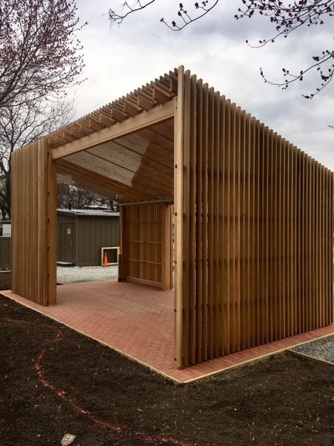 This structure was designed and built for the New York Restoration project in NYC. The entire structure is clad with 2x4 vertical Western Red Cedar slats. This contemporary structure also incorporates a 1/4" Acrylic (plexiglass) roof on the underside of the Rafters. Plexiglass Roof, Arbor Garden, Garden Arbor, House And Garden, Rain Protection, Outdoor Living Spaces, Pergola Kits, Shade Structure, Slat Wall