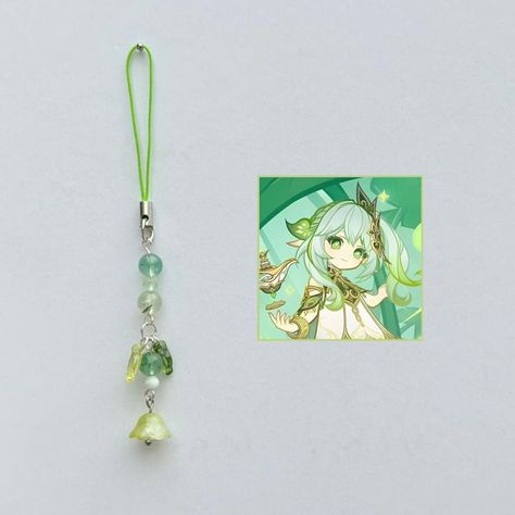 Nahida phone charm with green quartz, prehnite and angelite 🌱 ★彡[ꜱʜᴏᴘ ʟɪɴᴋ ɪɴ ʙɪᴏ]彡★ Handmade with ʀᴇᴀʟ ᴄʀʏꜱᴛᴀʟꜱ. ˚ ༘♡ ⋆｡˚𝓲𝓰𝓷𝓸𝓻𝓮 𝓽𝓱𝓮 𝓽𝓪𝓰𝓼 ˚ ༘♡ ⋆｡˚ #genshin #genshinimpact #genshinimpactedit #genshinimpactfanart #genshinimpactmihoyo #mihoyo #hoyolab #handmade #beads #explore #explorepage #navia #yaemiko #raidenshogun #hutao #fyp #phonecharm #phonestrap #smallbiz #smallbusiness #beads #xiao #furina #xianyun #neuvillette #venti #nahida #zhongli #kazuha Genshin impact phone charms Self Business, Kazuha Genshin, Bead Charms Diy, Phone Charms, Handmade Wire Jewelry, Green Quartz, Beaded Keychains, Handmade Beads, Phone Charm