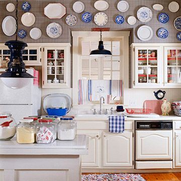 "cottage kitchen" ideas from bhg.com, the multi-paned cabinet doors and mismatched but coordinating hanging plates. Kitchen Soffit, Decorating Above Kitchen Cabinets, Above Kitchen Cabinets, Above Cabinets, Cottage Kitchens, Plate Decor, Blue Kitchens, Cabinet Decor, Cottage Kitchen