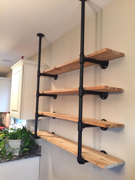 HGTV pipe shelving ! Rigid Pipe Shelves, Industrial Wall Mounted Shelving, Black Pipe Wall Shelves, Shelves With Pipes Industrial Style, Iron Rod Shelves, Shelves Made From Pipes, Industrial Pipe Floating Shelves, Metal Rod Shelves, Pvc Pipe Shelves