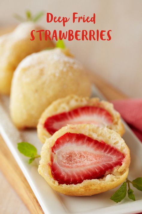 Juicy strawberries become juicier when coated with a light batter and deep-fried until golden. It's a whimsical treat that you'll love to serve. Use a candy thermometer to heat oil to the right temperature and be careful. A light dusting of confectioners' sugar adds a touch of sweetness. Deep Fried Strawberries, Fried Strawberries, Buffet Recipes, Carnival Treats, Strawberry Recipe, Polish Desserts, State Fair Food, Berry Recipes, Carnival Food