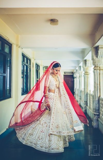 Sangeet Lehengas - White Lehenga with Golden Embroidery and a Red Dupatta | WedMeGood #wedmegood #indianbride #indianlehenga #bridal #white #lehenga #twirling White Bridal Lehenga, Bridal Lehenga Images, Sabyasachi Lehenga Bridal, Sabyasachi Bridal, Indian Bridal Lehenga, Bridal Lehenga Red, Bridal Outfit, Red Wedding Dresses, Indian Bridal Dress