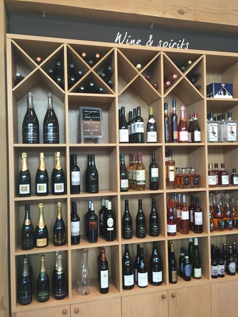 Wine And Spirits Shop Design, Liquor Store Display Ideas, Liquor Store Design Interiors, Bar Shelves Ideas, Backyard Storage Buildings, Wine Store Display, Wine Store Design, Bar Lounge Design, Grocery Store Design