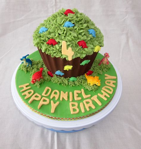 Dinosaur Themed Green giant cupcake Dinosaur Giant Cupcake, Cupcake Dinosaur, Dinosaur Cupcake Cake, Giant Cupcake Cake, Giant Cupcake Cakes, Big Cupcake, Giant Dinosaur, Dinosaur Cupcakes, Dino Cake