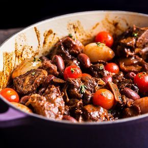 Lamb is braised in red wine before getting tossed with olives and tomatoes in this recipe from Houston chef Chris Shepherd's new restaurant, One Fifth. Lamb Neck Fillet Recipes, Lamb Neck Recipes, Fillet Recipes, Lamb Stew Recipes, Braised Lamb, Lamb Dishes, Winter Dishes, Lamb Stew, Dinner Party Menu