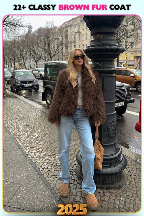 Oversized brown fur jacket with a fluffy texture ideal for streetwear. A perfect choice for layering over denim or boots, giving off an edgy and stylish vibe. Brown Fur Coat Outfit Street Style, Madrid Fall Outfits, Brown Fur Outfit, Brown Fluffy Jacket Outfit, Cream Fur Coat Outfit, Short Fur Coat Outfit, Brown Uggs Outfit, Boho Chic Outfits Winter, Brown Fur Coat Outfit