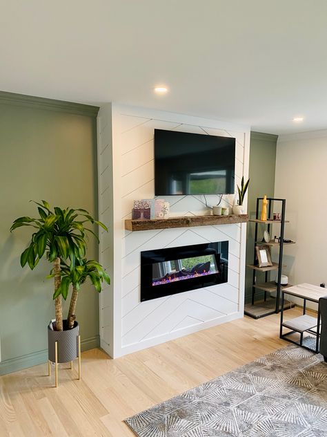 Our Shiplap fireplace with evergreen fog walls Shiplap Herringbone Fireplace, White Fireplace Green Wall, Green Wall White Fireplace, Evergreen Fog Fireplace, Herringbone Shiplap Fireplace, Evergreen Fog Walls, Green Fireplace Wall, Vertical Shiplap Fireplace, Vapor Fireplace