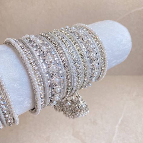 2 Stunning stacks of luxurious silver bangles with with our silver daisy bangles and finished with the prettiest pearl & faux kundan jhumka drop bangle.  Perfect for reception brides or those wanting to make a statement. Ready to Ship! Bridal Survival Kit, Kundan Jhumka, Reception Bride, Bangle Box, Indian Accessories, Fancy Jewellery Designs, Bridal Choker, Asian Jewelry, Bridal Necklace Set