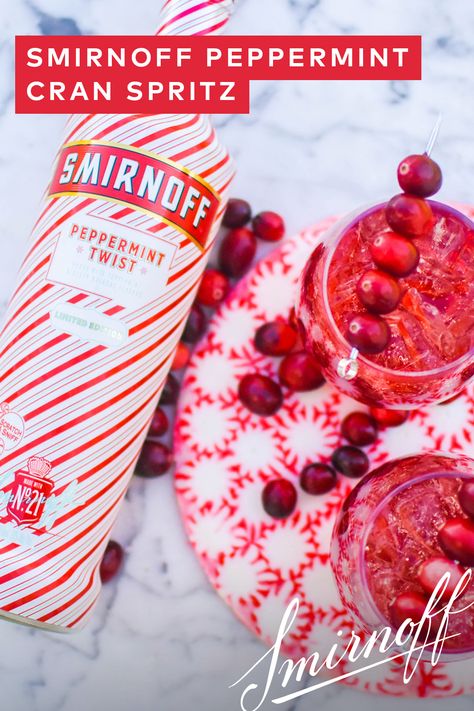 Key to hosting a great holiday party? Having a festive cocktail ready to go that is easy to prepare, like this Peppermint Cran Spritz featuring our limited edition Smirnoff Peppermint Twist.   RECIPE: 1.5 oz Smirnoff Peppermint Twist, 2 oz cranberry juice, 0.5 oz orange liqueur. Top with club soda. Visit BeautifulBooze.com for full instructions! Cranberry Peppermint Cocktail, Christmas Drinks With Peppermint Vodka, Smirnoff Peppermint Vodka Recipes, Peppermint Liquor Drinks, Peppermint Vodka Recipes, Peppermint Snapps Drinks, Peppermint Smirnoff Drinks, Peppermint Twist Smirnoff Drinks, Peppermint Smirnoff Recipe