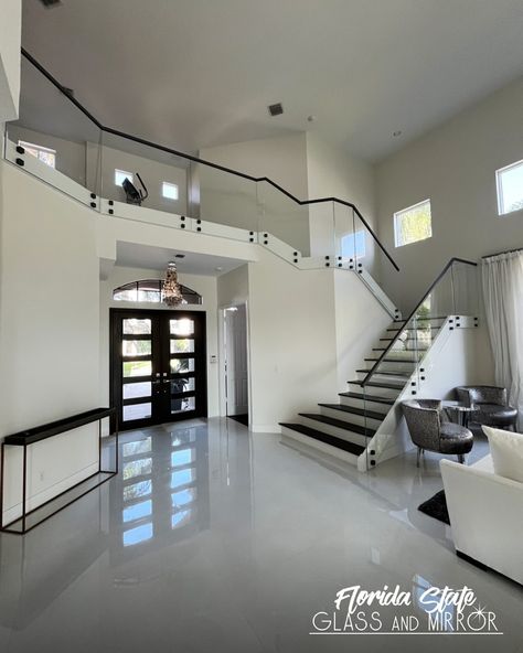 Glass staircase railings blend in with any interior design and can make even the narrowest stairway appear larger!⁣ .⁣ .⁣ .⁣ .⁣ .⁣ #railing #staircase #homedecor #stairs #luxuryhomes #home #interiordesign #railings #staircasedesign #modernhomedecor #glassrailing #glassrailings #glassexperts #floridastateglass Glass Staircase Railing, Black And White Stairs, Stairs Storage, Staircase Ideas, Glass Staircase, Staircase Railings, Glass Railing, Stair Storage, Staircase Design