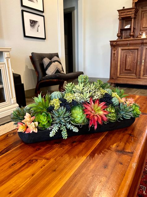 Faux succulent arrangement with varying hues of green, orange, & red with chartreuse & navy accents in a black wood container. Beautiful table centerpiece, housewarming, birthday, Christmas gift. Approximate size: (across greenery) Length - 19” Width - 10” Height - 9” Container - 18” x6” x2” Have questions? Feel free to send me a message. 😊 I usually respond within a few hours. Terracotta Succulent Centerpieces, Succulent Tray Centerpiece, Large Succulent Table Centerpiece, Succulent Arrangements Terracotta, Succulent And Wood Centerpiece, Succulent Bowls, Dining Room Table Centerpieces, Artificial Floral Arrangements, Succulent Garden Diy