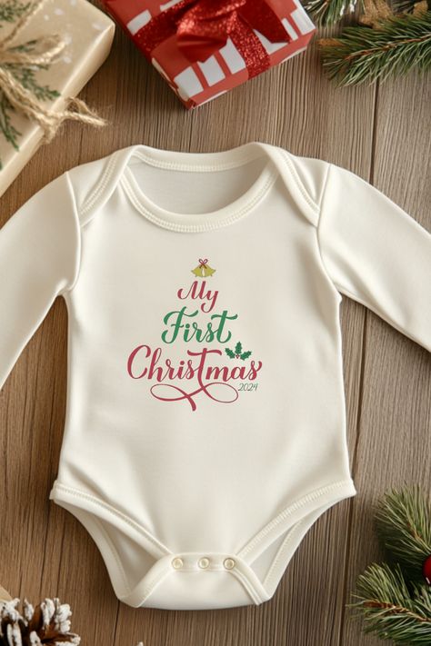 Introducing our adorable "My First Christmas" onesie featuring a festive Christmas tree design! Perfect for capturing those precious holiday photos and as a thoughtful baby shower gift, this onesie is sure to spread cheer all season long. Get ready to make unforgettable memories. My First Christmas Onesie, First Christmas Onesie, Thoughtful Baby Shower Gifts, Christmas Onesie, My First Christmas, Baby's First Christmas, Christmas Tree Design, Unforgettable Memories, Tree Design