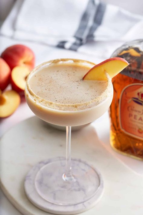 Peach Cobbler Martini, Peach Cobbler Old Fashioned Cocktail, Crown Peach Cocktail, Peach Cobbler Drink Recipe, Peach Cobbler Drink, Peaches And Cream Cocktail, Peach Moonshine Cocktails, Peach Cobbler Cocktail, Crown Peach Drinks Recipes Cocktails