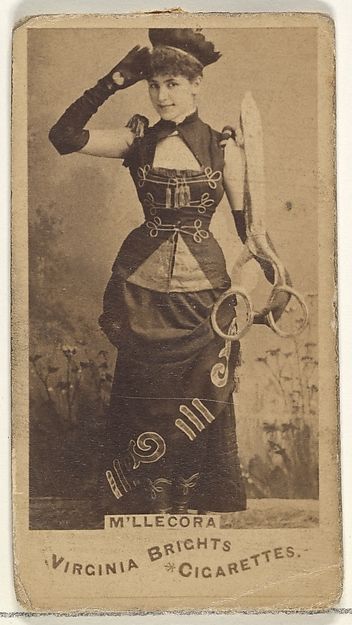 M'lle Cora, from the Actors and Actresses series (N45, Type 1) for Virginia Brights Cigarettes. c. 1888 Victorian Fancy Dress, Victorian Halloween, Victorian Costume, Cabinet Card, Steampunk Costume, Stage Costume, Historical Costume, Historical Clothing, Vintage Photography