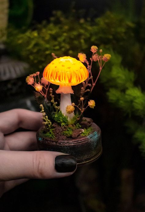 MADE to Order ❄ Mushroom night light ❄ With built-in rechargeable battery The mushrooms are made in a very realistic art-style with precision attention to details that copies the real-mushroom structure and parts.          Materials and features: This handmade lamp is made of Polymer Clay and LED, glass flask with cork lid and with addition of natural and high quality stabilized moss and plants, they are soft, flexible and durable just like the live ones, but unlike them such plants wouldn't wither. It is decorated with natural stabilized moss, tree bark and modeling grass. The lamp might also include genuine hand-sculpted and hand-painted plants. NO CHEAP PLASTIC PLANTS-IMITATIONS IS USED The base is made with use of 3d-print technology by genuine Snowmade templates, the material that is