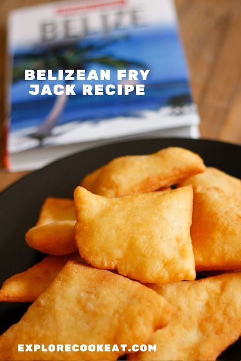 A black plate filled with fried dough pieces called fryjacks, and a book of Belize travel in the background. Fry Jacks Belize Recipe, Belizean Fry Jack Recipe, Fry Jack, Fry Jacks, Belizean Recipes, Belizean Food, Amish Food, Belize Food, Yeast Free Breads