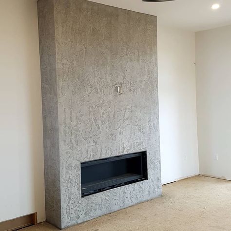 Seamless concrete texture on the fireplace in the living room of the new house in Oakville, Ontario #concretefireplace #torontointeriordesign #concreteinteriors #concretewalltexture  #torontointeriors Concrete Fireplace Wall, Textured Fireplace, Texture Fireplace, Reclaimed Brick Wall, Concrete Wall Texture, Accent Wall Design, Moss Walls, Toronto Interior Design, Concrete Interiors