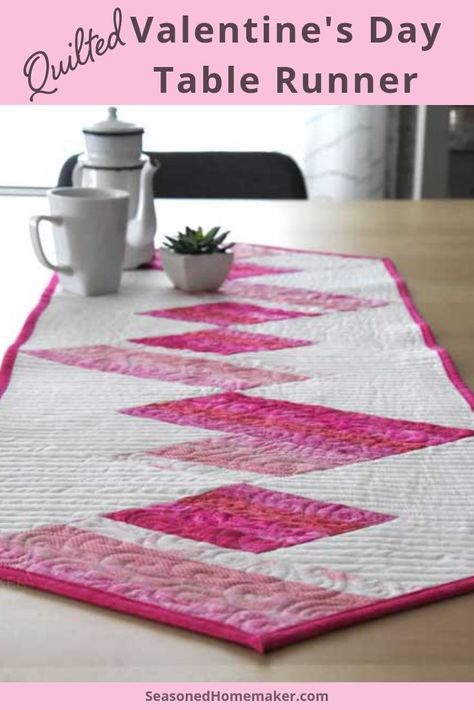 Learn How to Make a Valentine's Day Quilted Table Runner. It's easier than you think when you use strip piecing and the right tool. #ValentinesDayTableRunner #valentinesquilts #wallhangings #quiltedtablerunner #diyvalentinesideas #valentinesquitingtutorial  #seasonedhomemaker Table Runner Ideas, Machine Binding A Quilt, Kitchen Table Runner, Pinwheel Quilt Block, Valentine Table Runner, Valentine Table, Strip Piecing, Log Cabin Quilt Blocks, Sewing Machine Cover